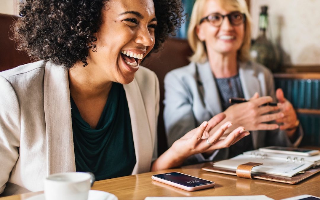 Business women laughing