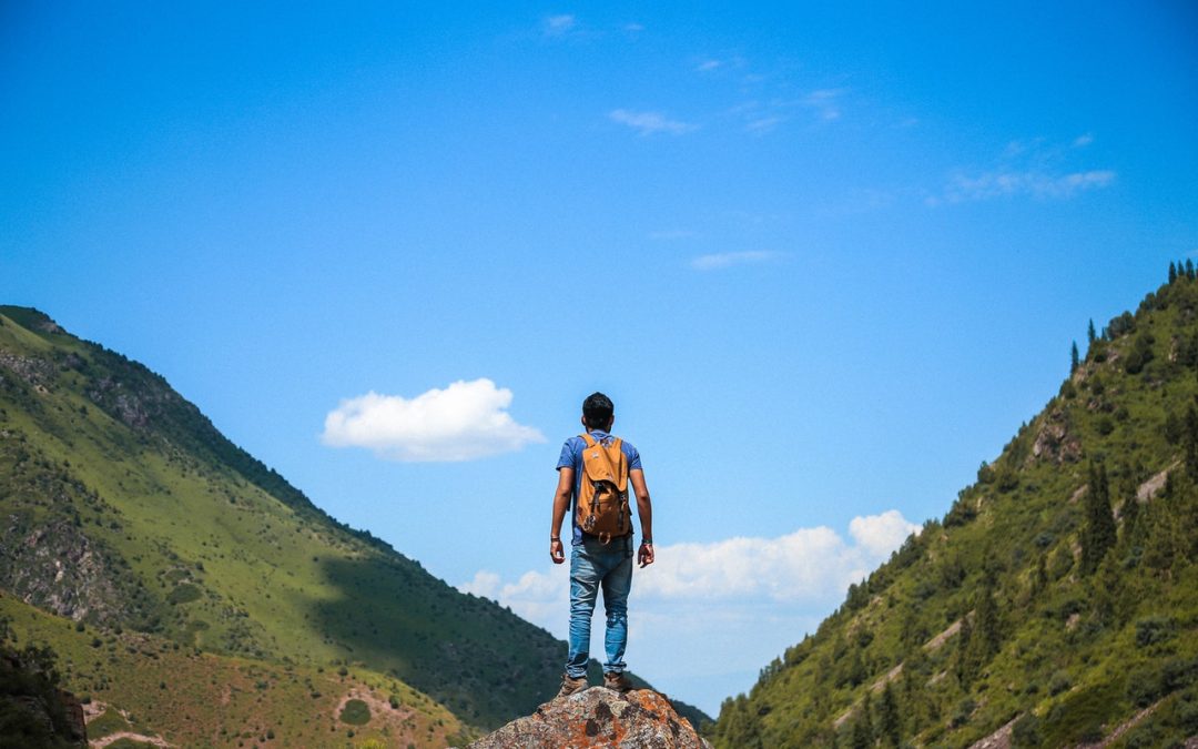 Man climbing a mountain