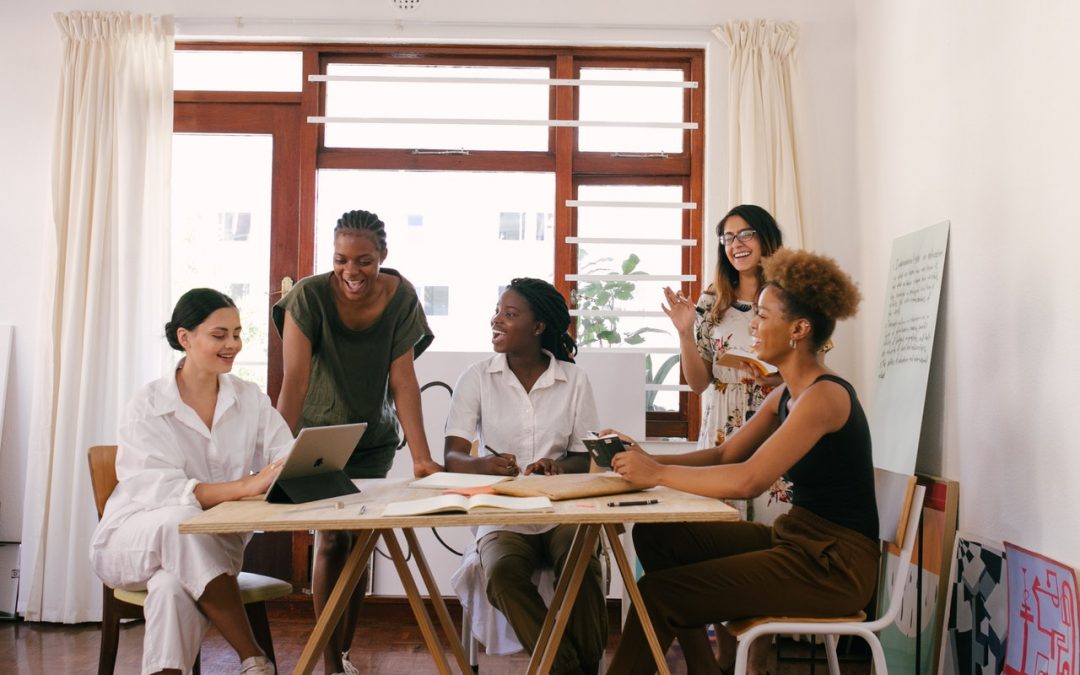 Excited woman's business team