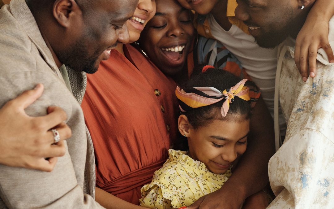 Generations of family in group hug