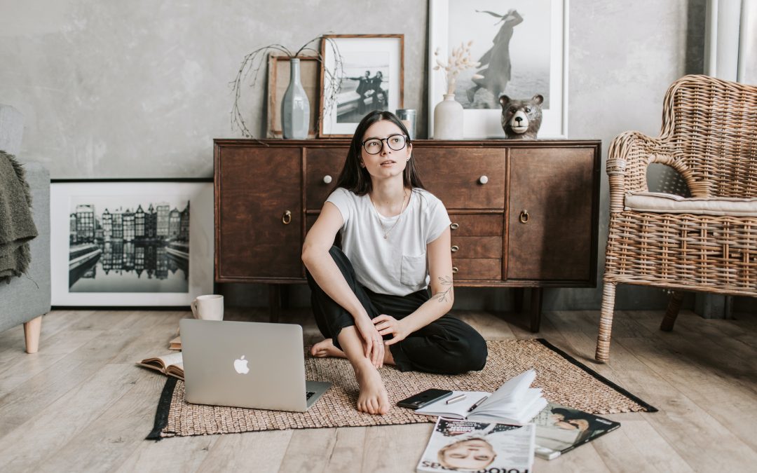 Woman sitting on floor thinking