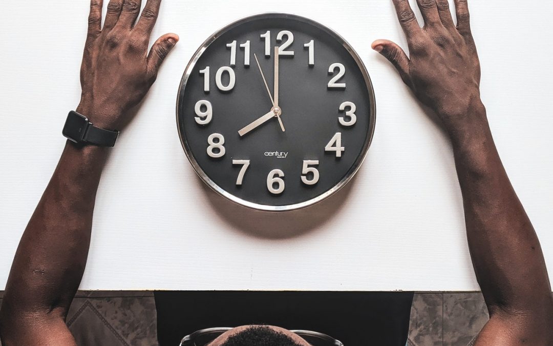 Man watching a clock