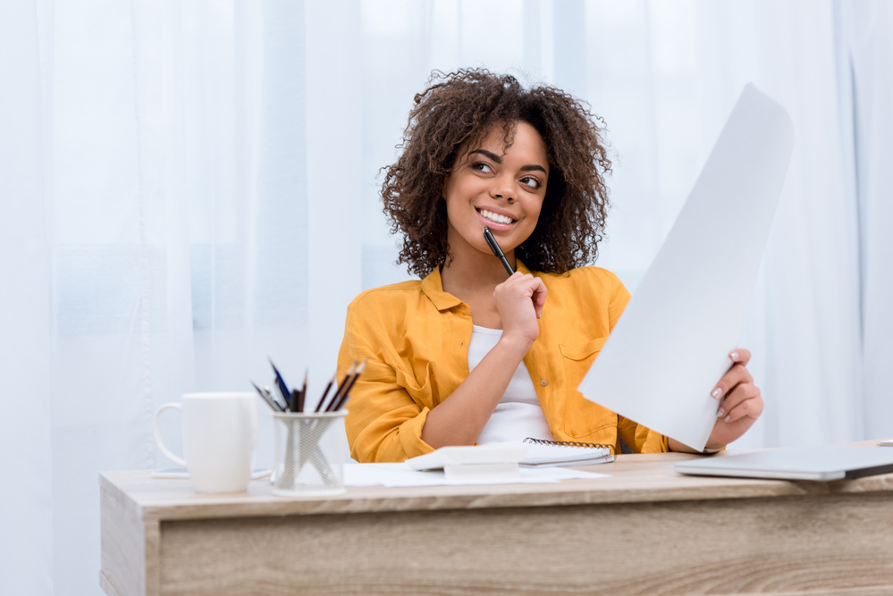 Young woman thinking and smiling