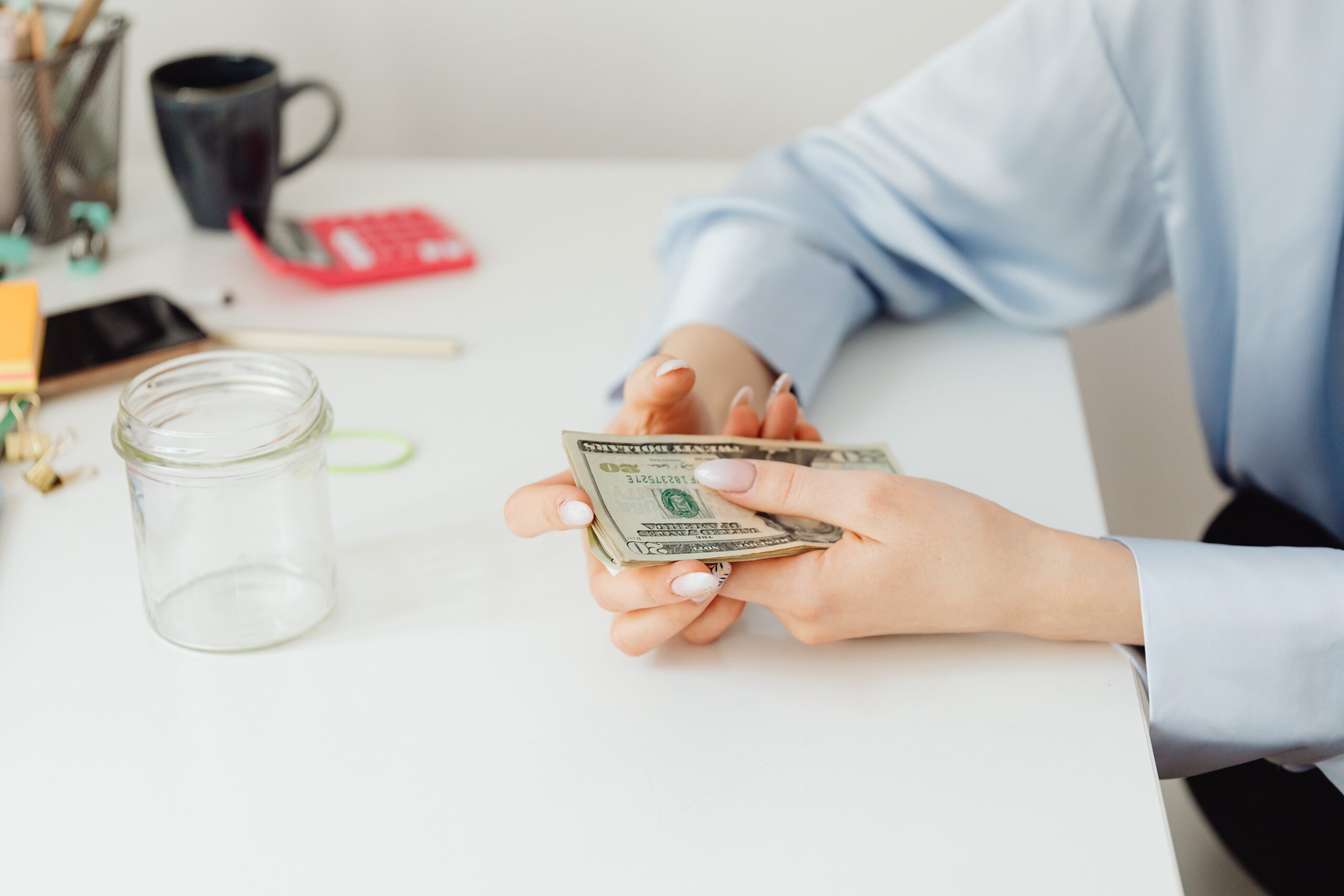 Woman holding a stack of money